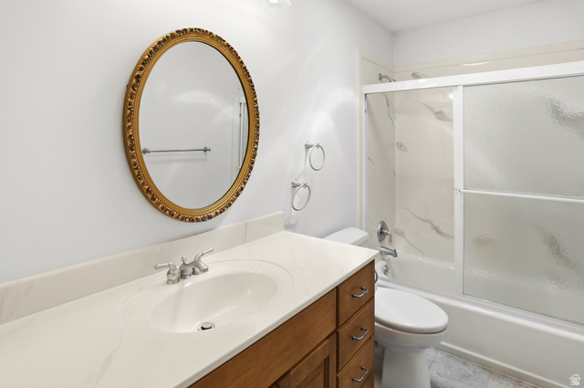 2190 750 West Perry, UT 84302 - Photo 25 of 42 Bathroom featuring a single vanity with wood-finish cabinetry, a light-toned countertop, and a built-in sink