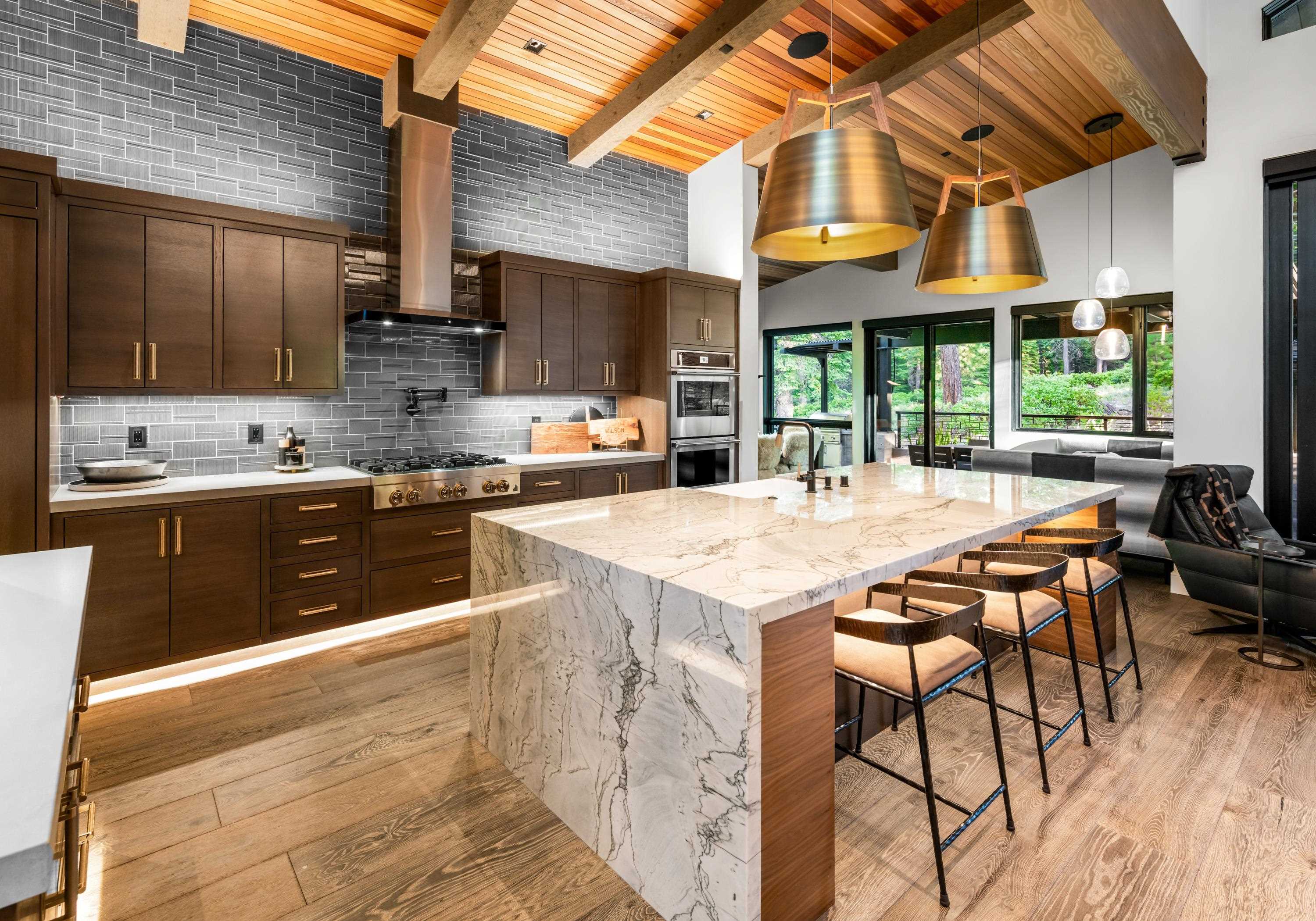 10625 Carson Range Road Truckee, CA 96161 - Photo 5 of 8 a kitchen with stainless steel appliances granite countertop a stove a sink dishwasher and cabinets with wooden floor