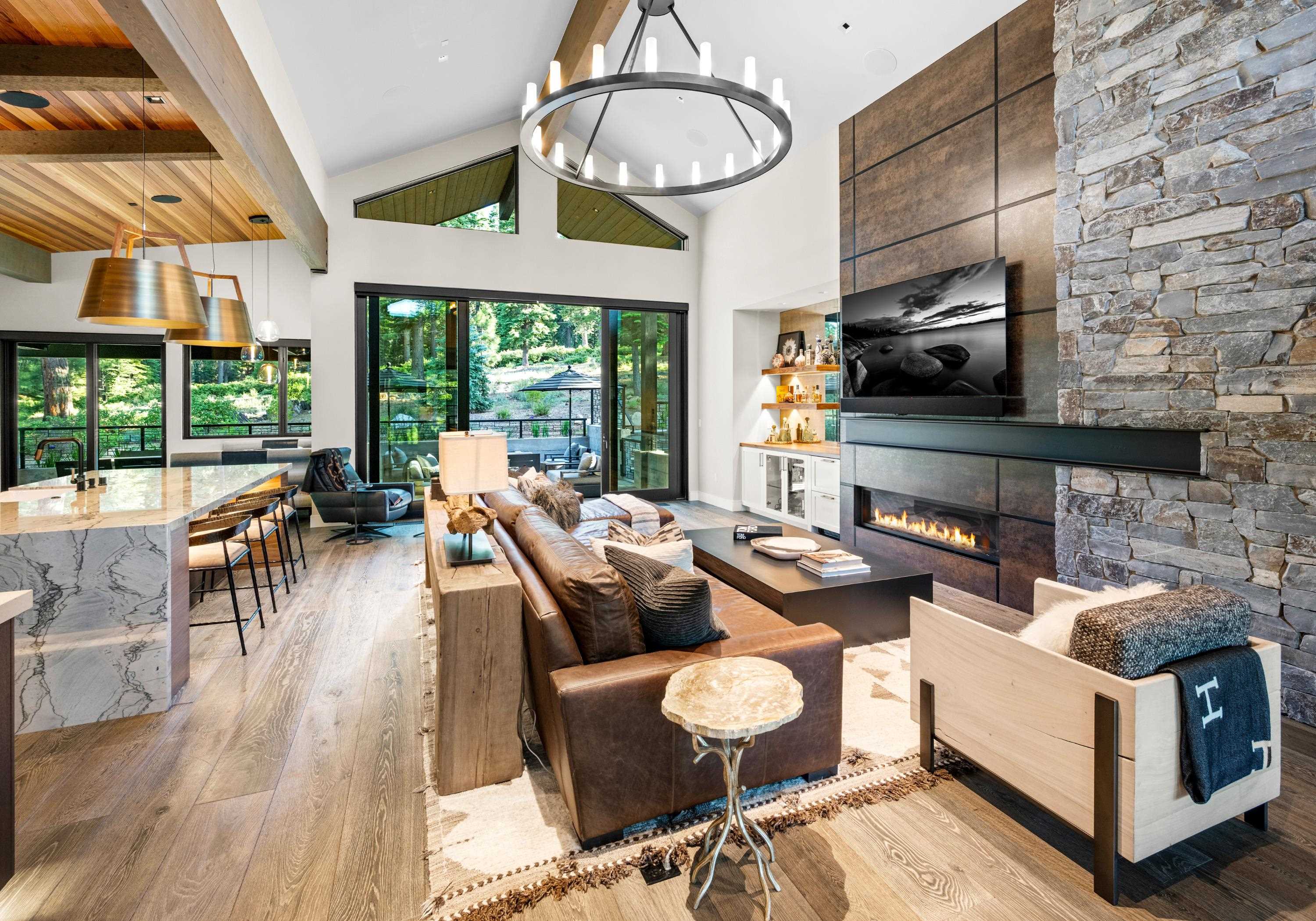 10625 Carson Range Road Truckee, CA 96161 - Photo 6 of 8 a living room with fireplace furniture and a large window