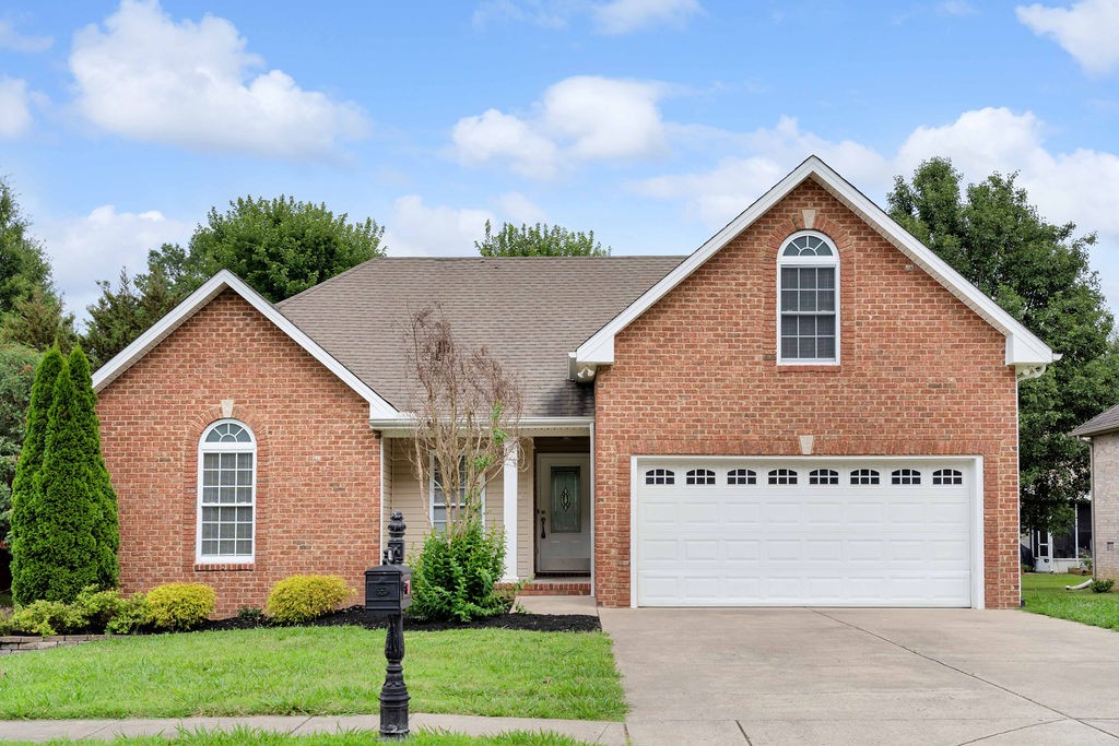 165 Foxrun Springfield, TN 37172 - Photo 1 of 62 a view of a house with a yard and garage
