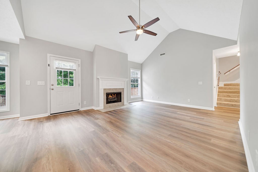 165 Foxrun Springfield, TN 37172 - Photo 12 of 62 an empty room with wooden floor a ceiling fan and windows