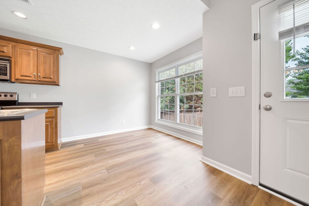 165 Foxrun Springfield, TN 37172 - Photo 16 of 62 a view of an empty room with wooden floor and a window