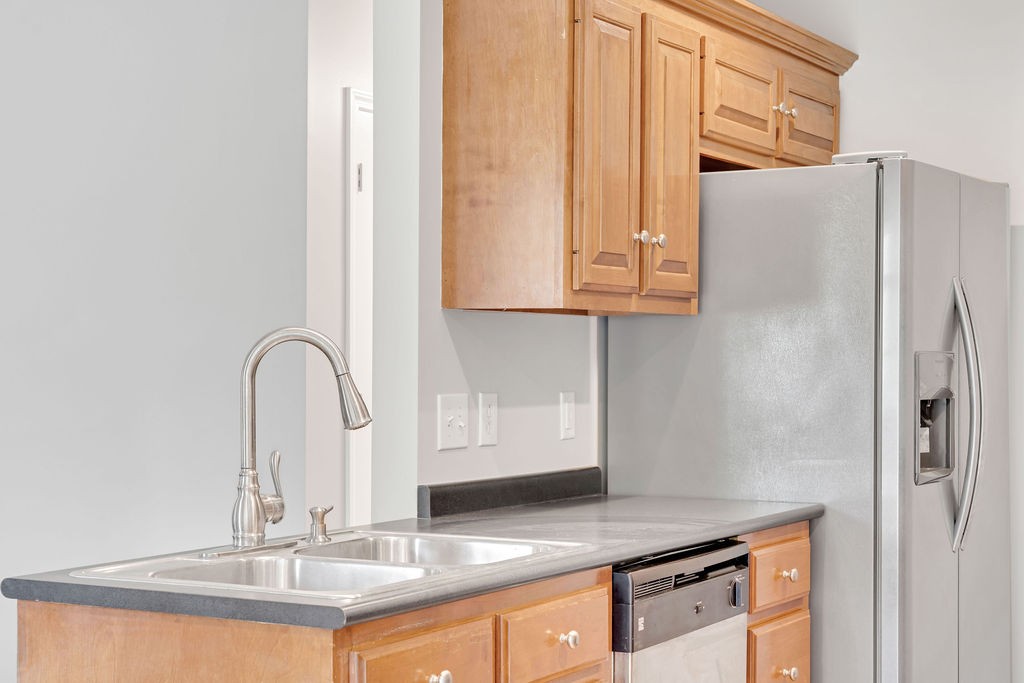 165 Foxrun Springfield, TN 37172 - Photo 21 of 62 a kitchen with stainless steel appliances granite countertop a refrigerator and a sink