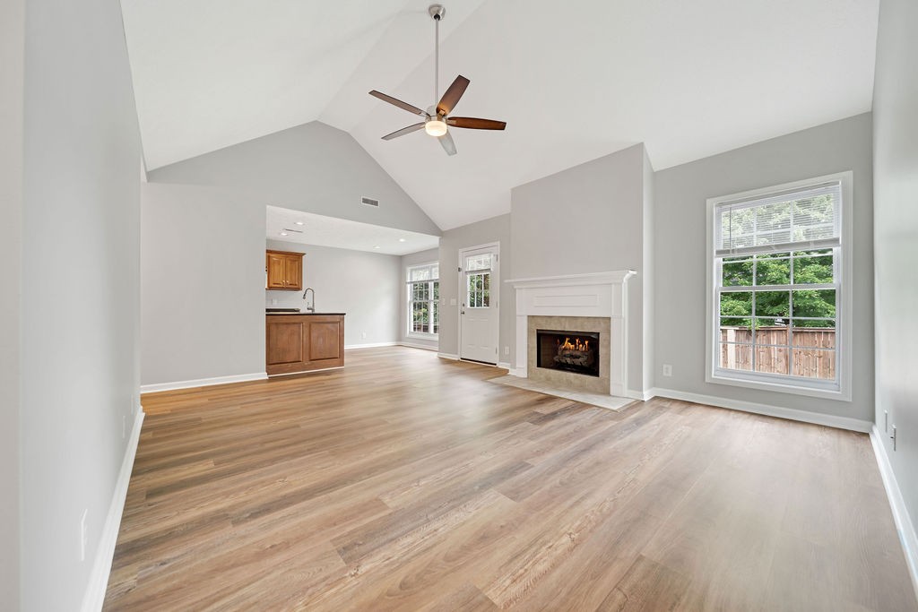 165 Foxrun Springfield, TN 37172 - Photo 9 of 62 a view of empty room with wooden floor and fireplace