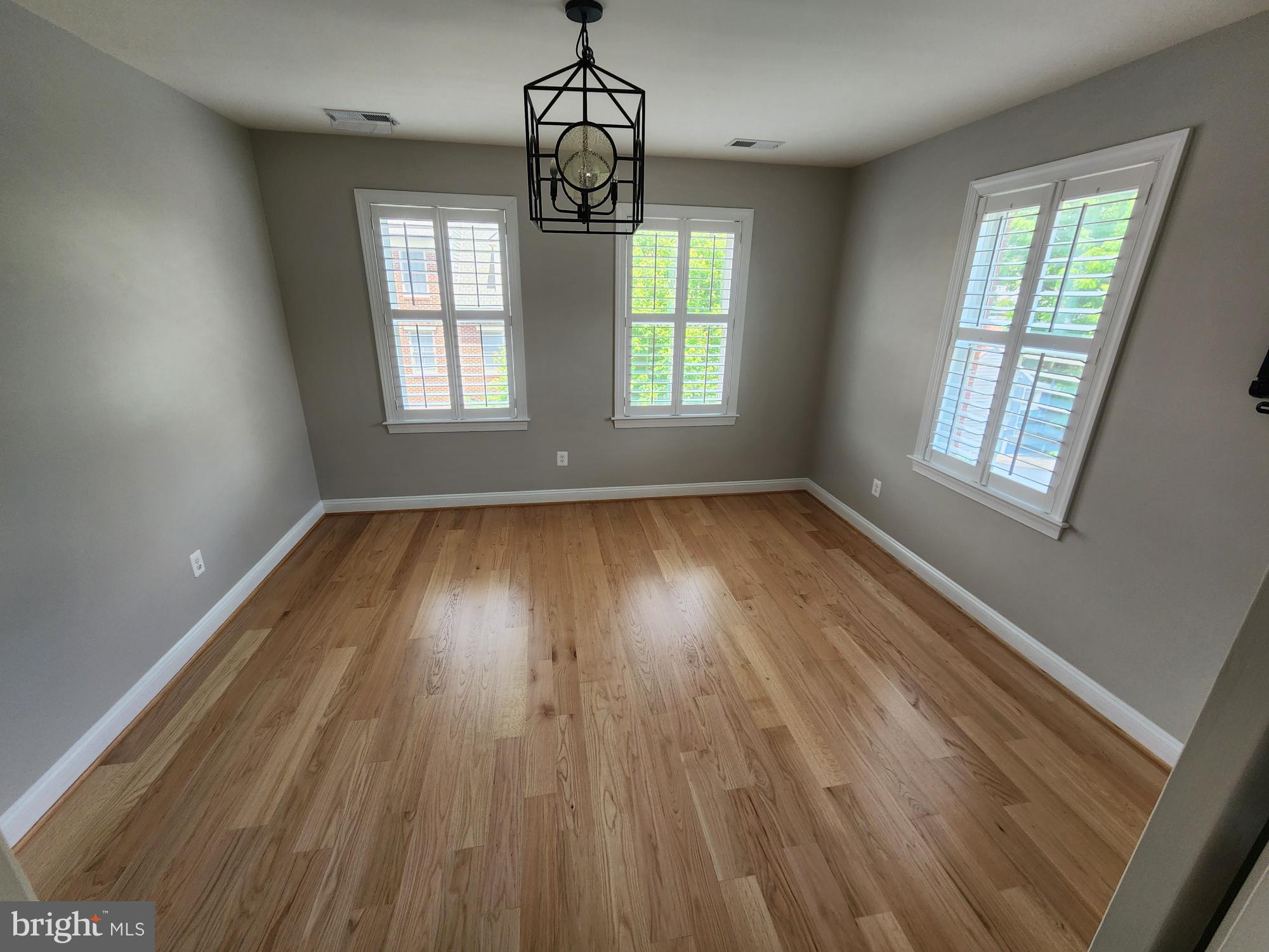 2 Maxwell Square Frederick, MD 21701 - Photo 7 of 16 wooden floor in an empty room with a window