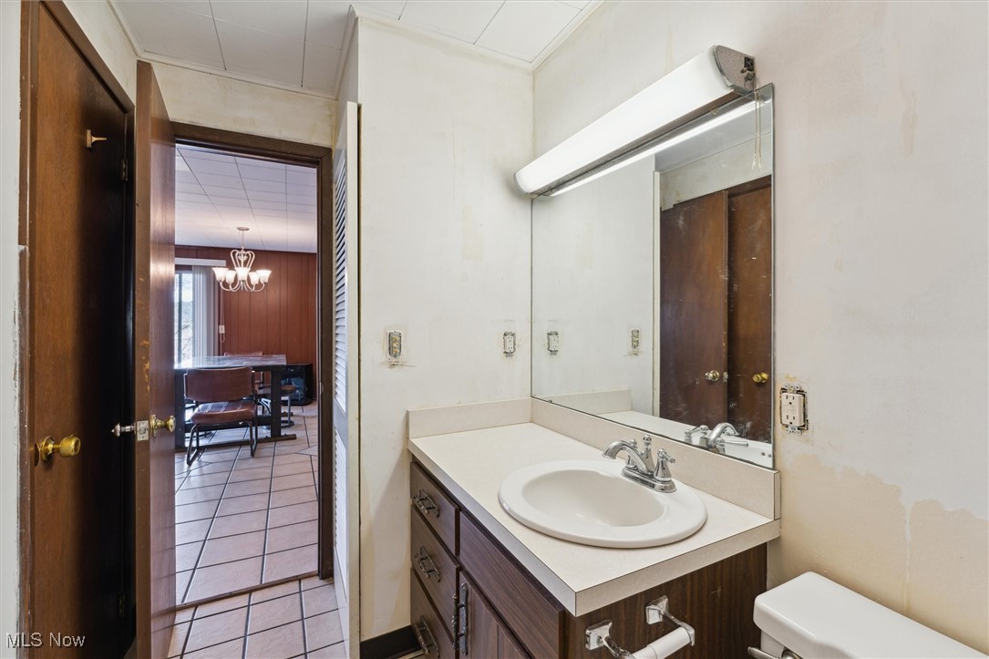 86413 North Bay Road Scio, OH 43988 - Photo 27 of 45 Bathroom featuring tile patterned flooring, vanity, a chandelier, and toilet
