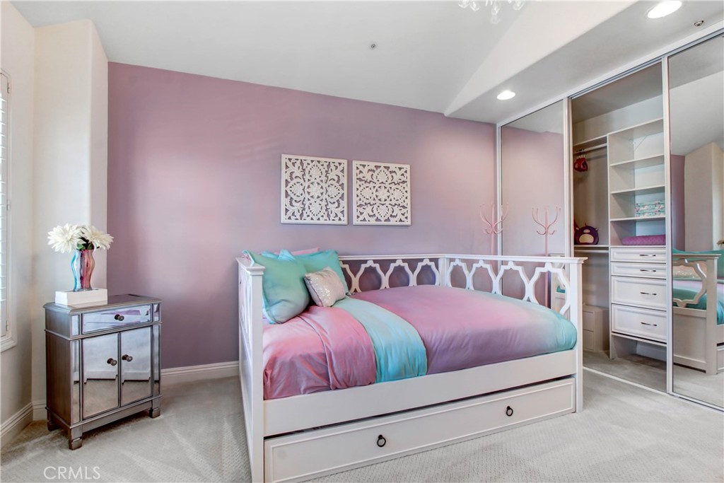 12036 Wood Ranch Road Granada Hills, CA 91344 - Photo 37 of 55 Upstairs 4th bedroom -Full size bed with trundle and extra large closet (purple wall has since been painted white)