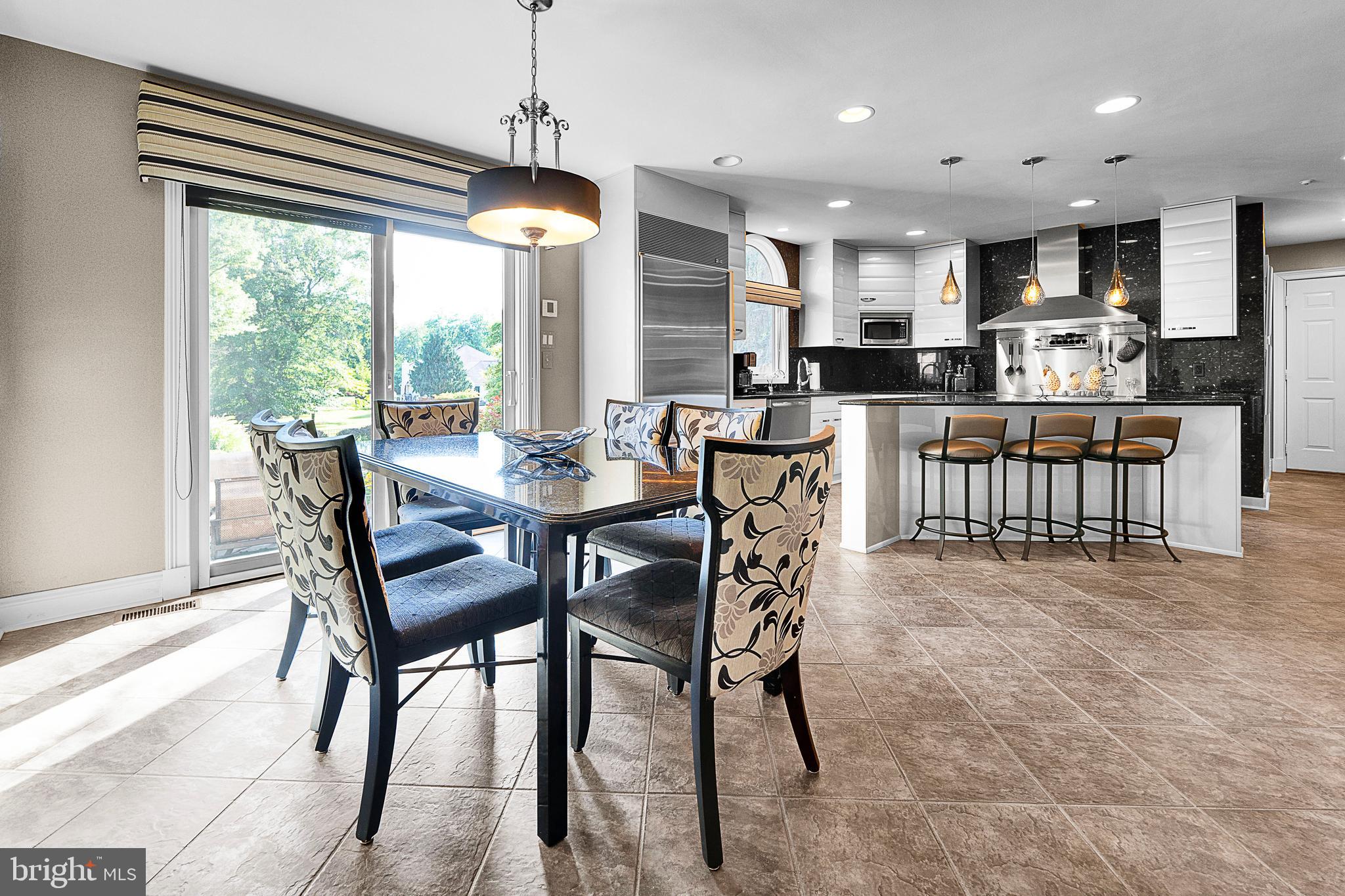 1233 Keisel Lane Ambler, PA 19002 - Photo 13 of 46 Sliders from Kitchen to Awninged Patio/Pool Area