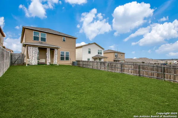 a view of a house with a back yard