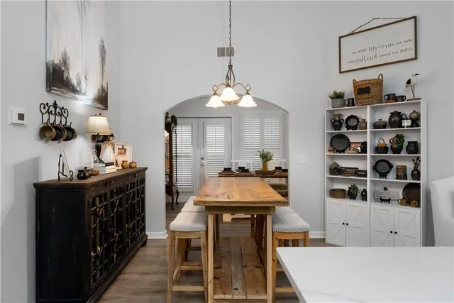 a dining room with a table and chairs in it