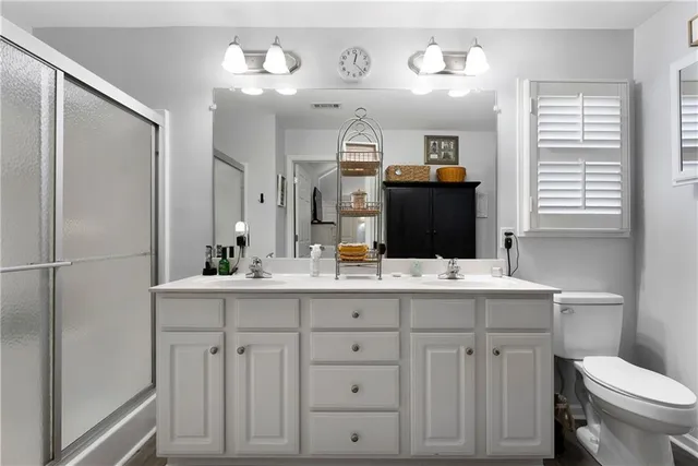 a bathroom with a sink vanity and mirror