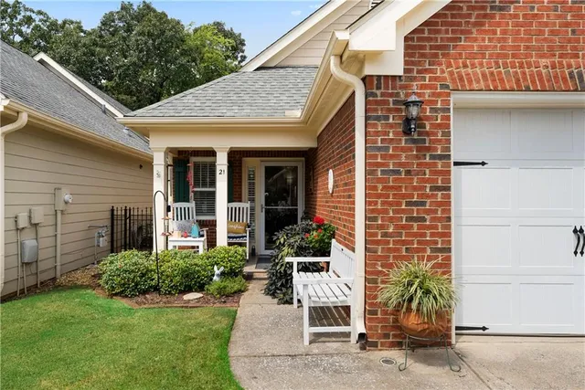 a front view of a house with garden