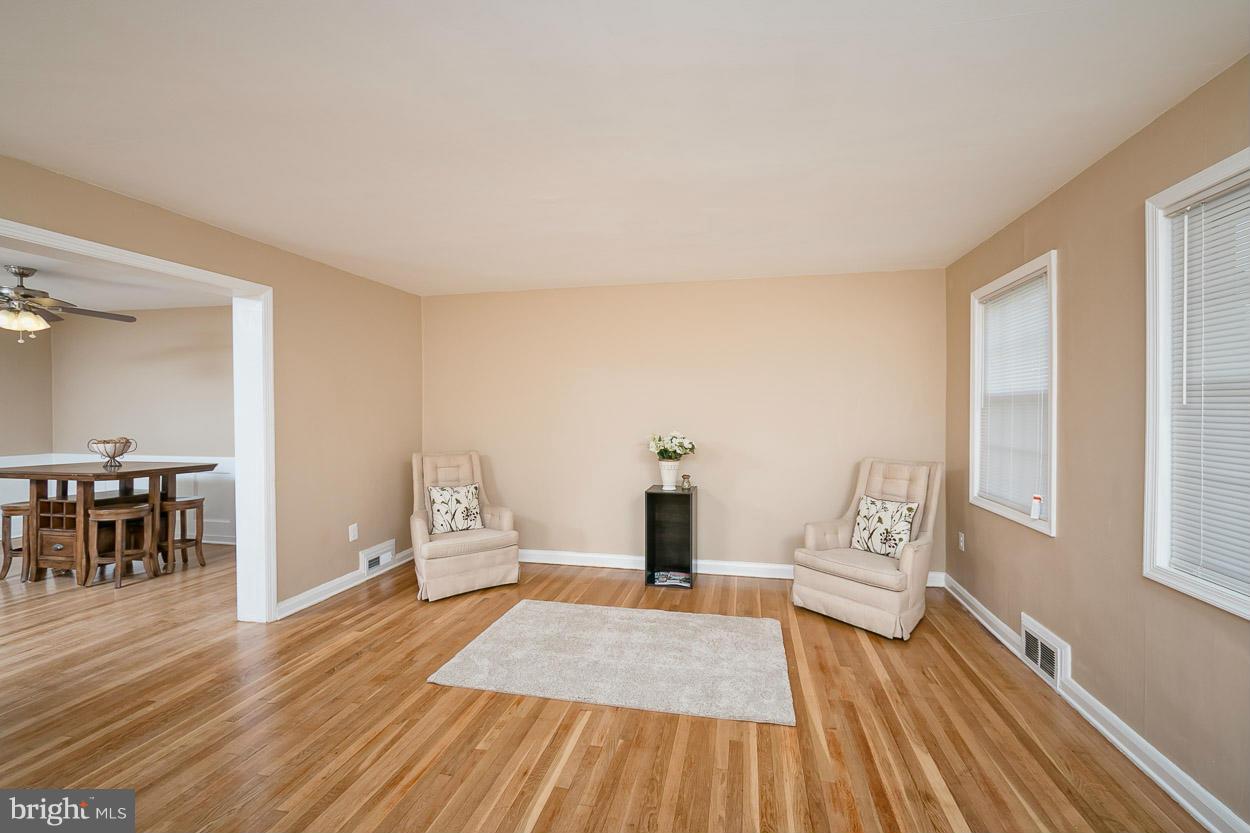 1347 Pentridge Road Baltimore, MD 21239 - Photo 8 of 30 a bedroom with a bed and wooden floor