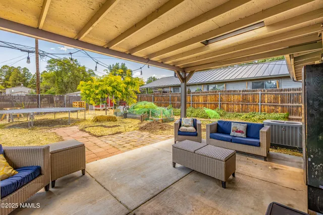 a outdoor living space with patio furniture and a potted plant