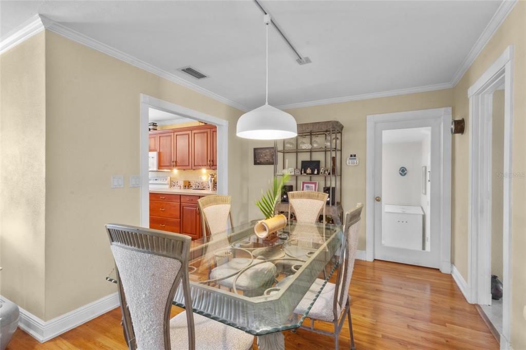 420 Pensacola Road Venice, FL 34285 - Photo 13 of 40 a view of a dining room with furniture window and wooden floor