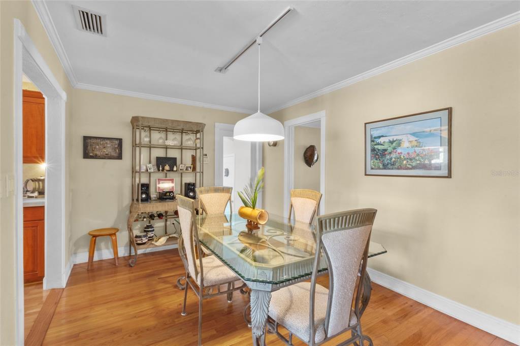 420 Pensacola Road Venice, FL 34285 - Photo 14 of 40 a view of a dining room with furniture window and wooden floor