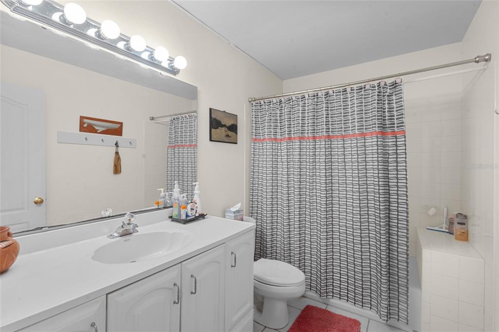 420 Pensacola Road Venice, FL 34285 - Photo 17 of 40 a bathroom with a sink a toilet and shower