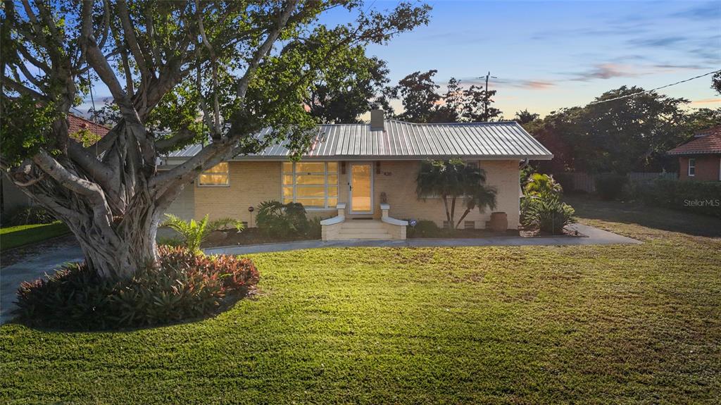 420 Pensacola Road Venice, FL 34285 - Photo 2 of 40 a view of a house with backyard and sitting area