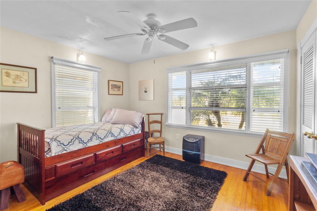 420 Pensacola Road Venice, FL 34285 - Photo 23 of 40 a bed room with a bed and a chair