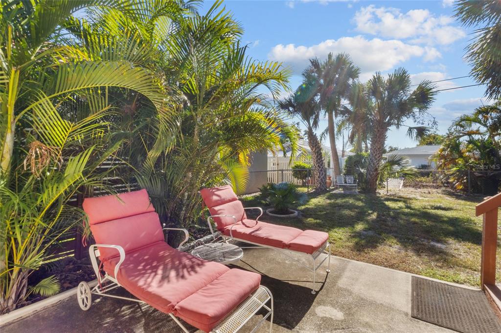 420 Pensacola Road Venice, FL 34285 - Photo 26 of 40 a backyard of a house with outdoor seating