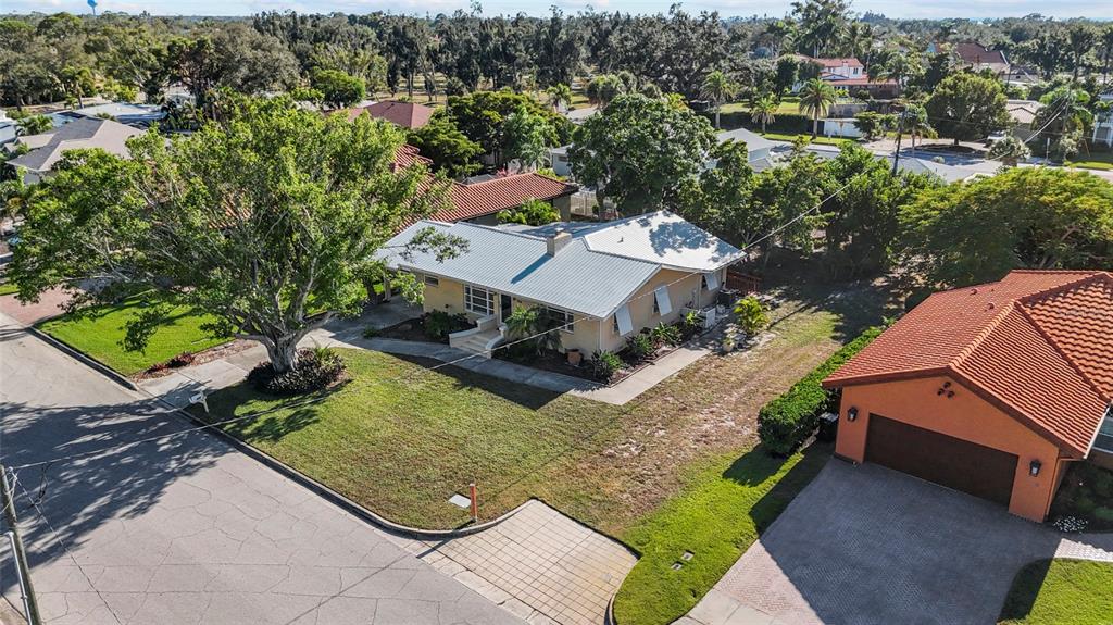 420 Pensacola Road Venice, FL 34285 - Photo 32 of 40 an aerial view of a house with a yard swimming pool patio and lake view