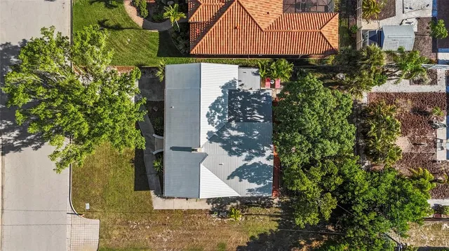 an aerial view of residential house with outdoor space