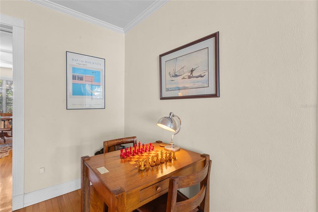 420 Pensacola Road Venice, FL 34285 - Photo 5 of 40 a workspace with furniture and wooden floor