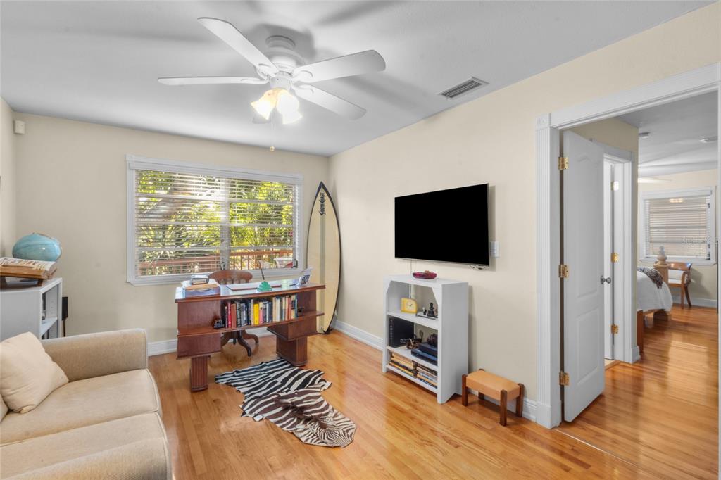 420 Pensacola Road Venice, FL 34285 - Photo 7 of 40 a living room with furniture and a flat screen tv
