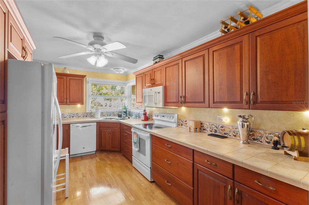 420 Pensacola Road Venice, FL 34285 - Photo 10 of 40 a kitchen with a sink cabinets stainless steel appliances and a counter top space