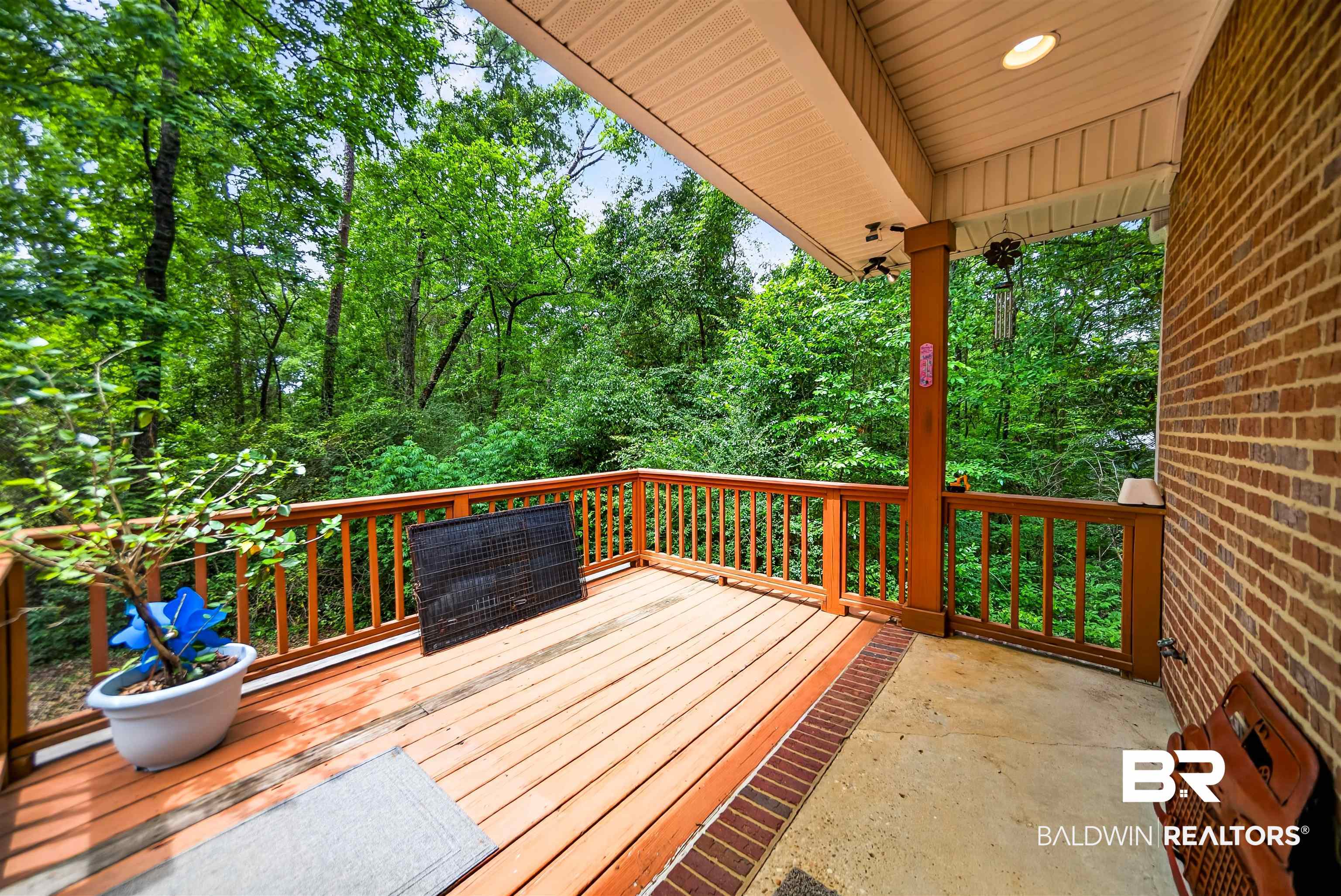 5913 Antoine Road Mobile, AL 36693 - Photo 25 of 33 Expansive wood-finish deck with a wood railing system