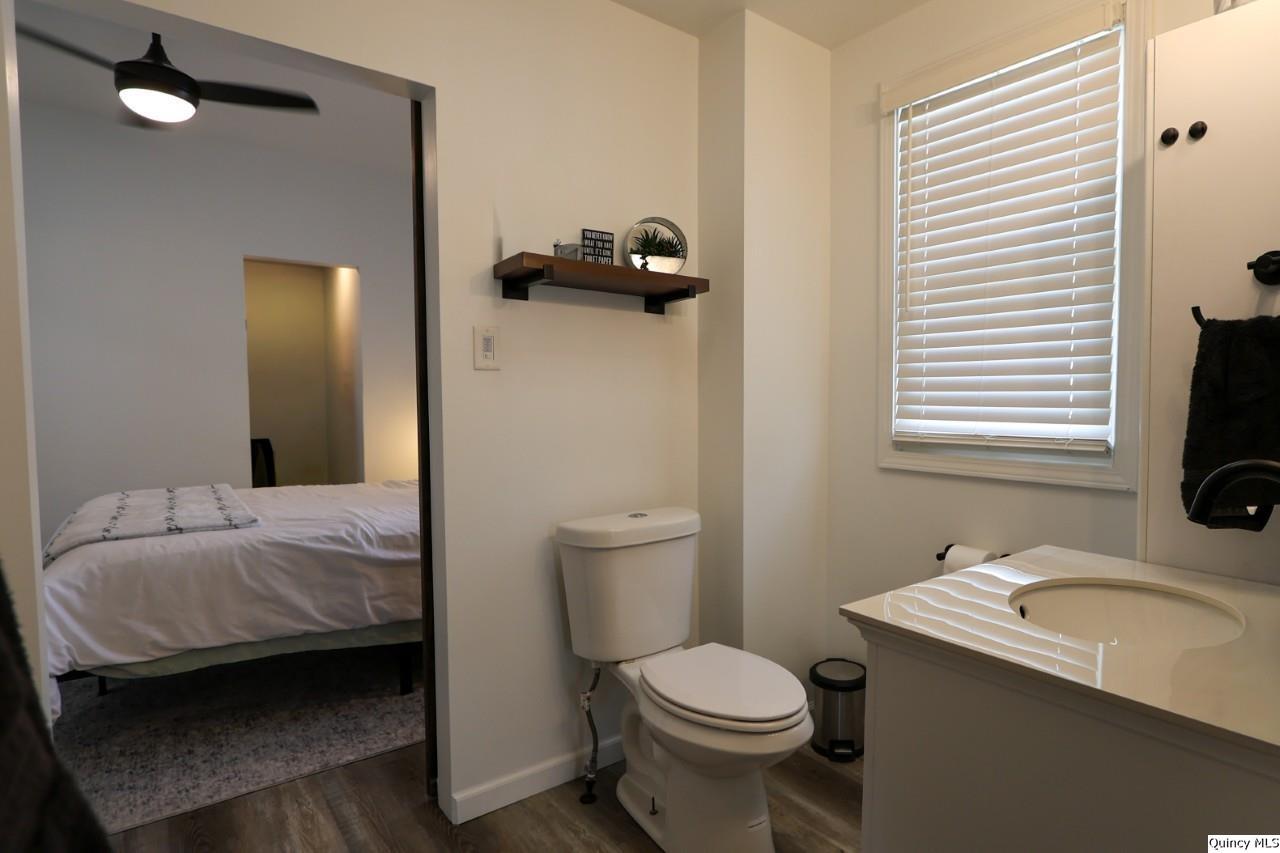 630 South 19th Street Quincy, IL 62301 - Photo 11 of 17 a bathroom with a sink toilet and shower