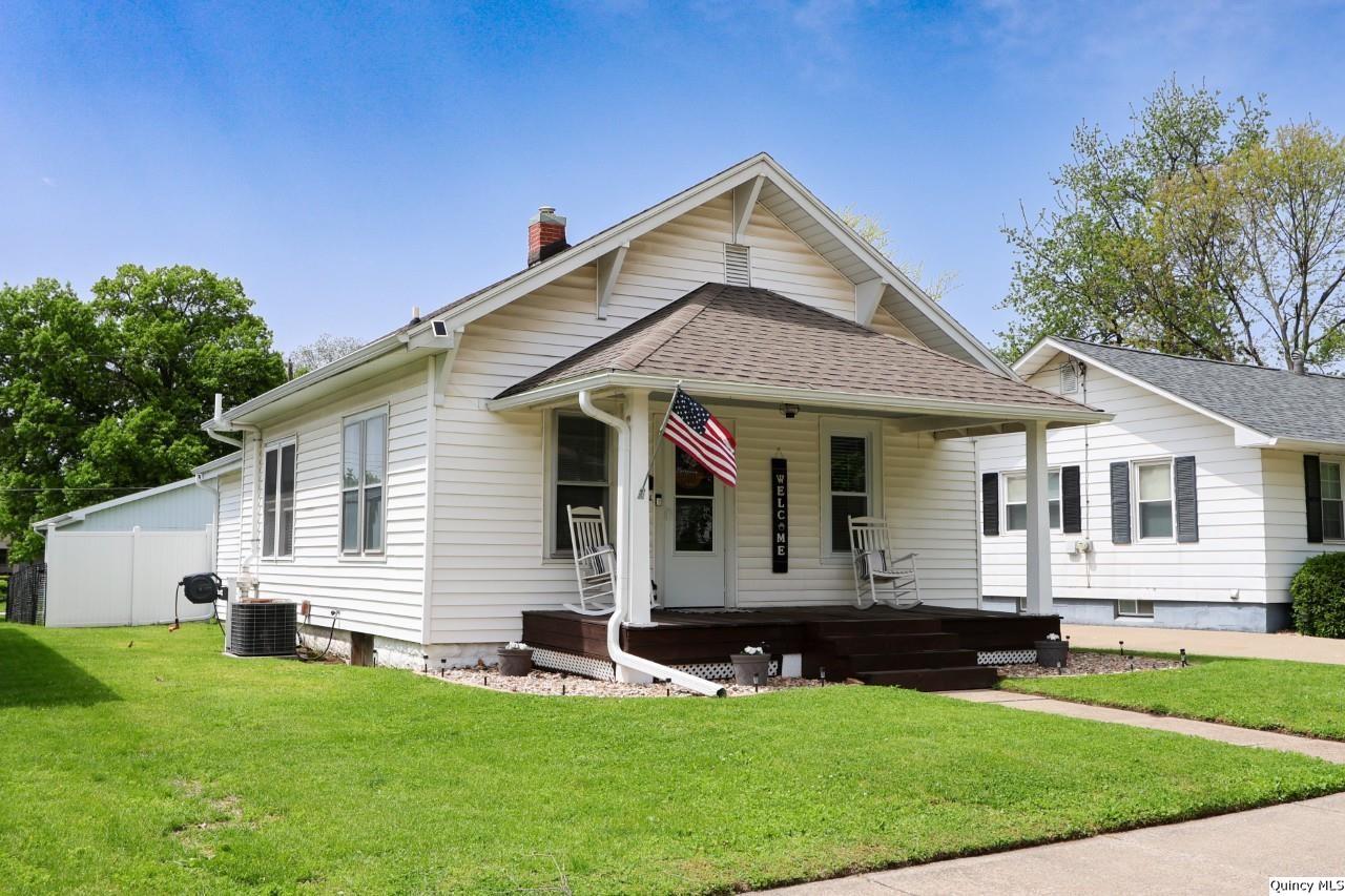 630 South 19th Street Quincy, IL 62301 - Photo 14 of 17 a front view of a house with a yard
