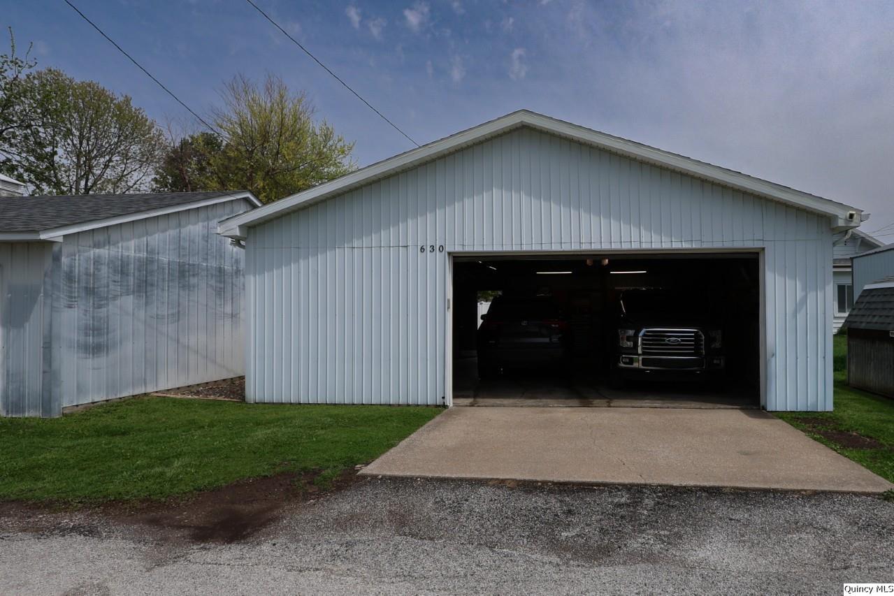 630 South 19th Street Quincy, IL 62301 - Photo 3 of 17 a front view of a house with a yard and garage