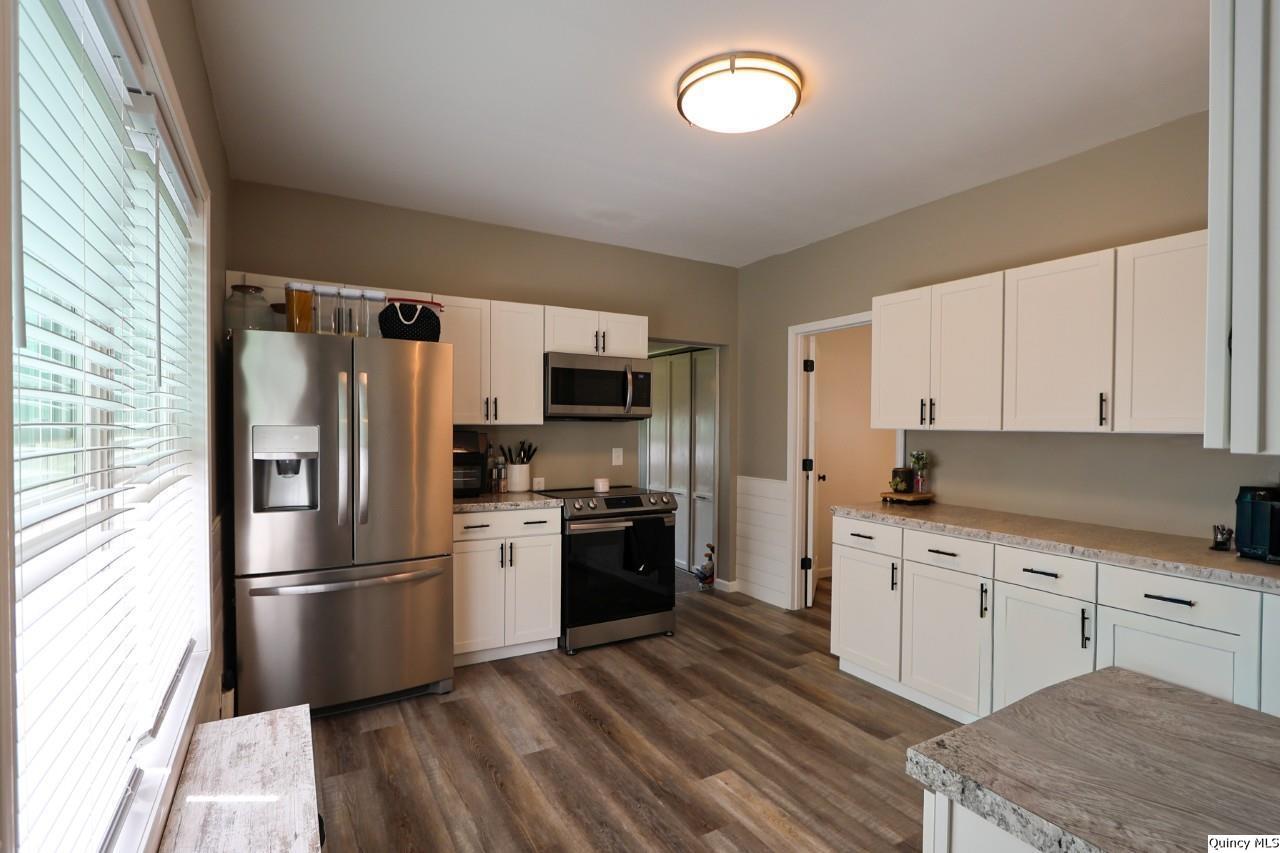 630 South 19th Street Quincy, IL 62301 - Photo 5 of 17 a kitchen with stainless steel appliances a refrigerator sink and microwave