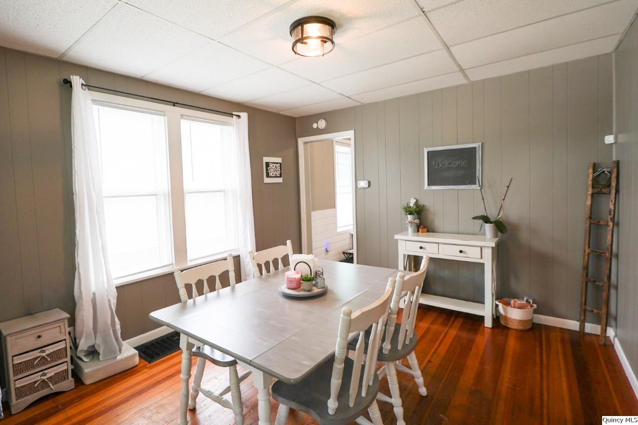 630 South 19th Street Quincy, IL 62301 - Photo 6 of 17 a view of a dining room with furniture window and wooden floor