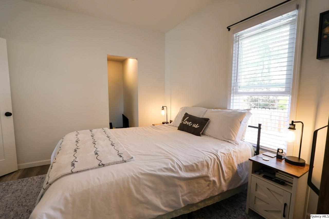 630 South 19th Street Quincy, IL 62301 - Photo 9 of 17 a bedroom with a bed and a window