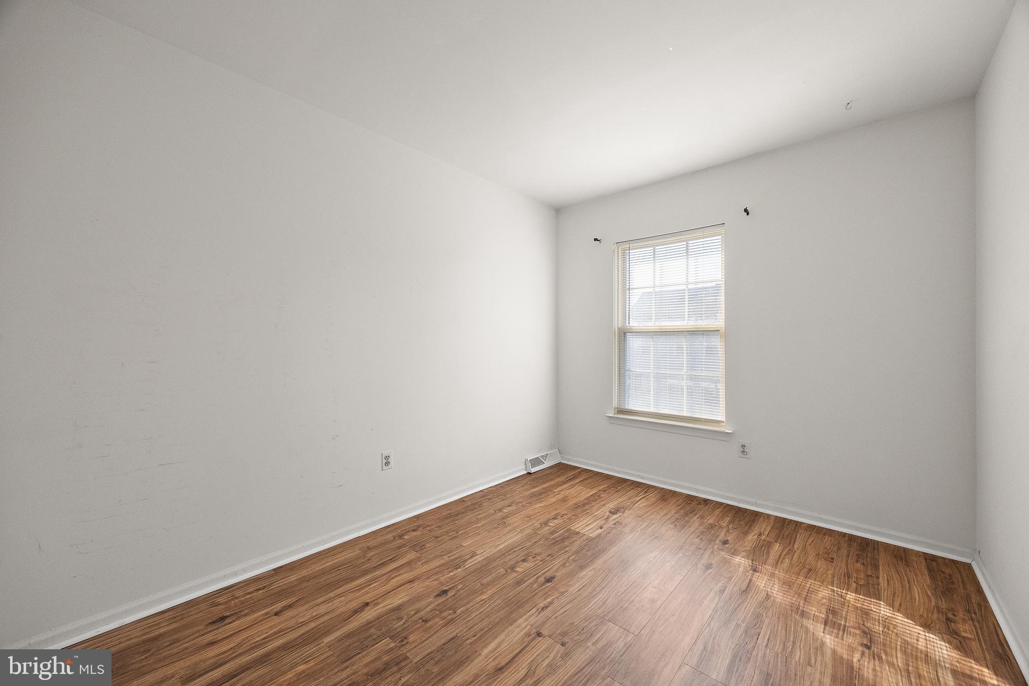 78 3 Rivers Drive Newark, DE 19702 - Photo 15 of 27 an empty room with wooden floor and windows