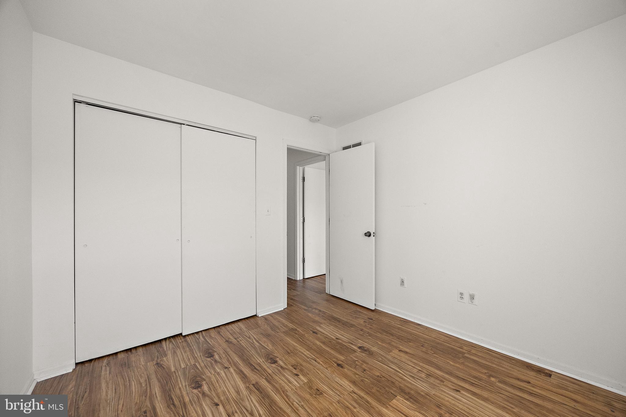 78 3 Rivers Drive Newark, DE 19702 - Photo 18 of 27 a view of an empty room with wooden floor