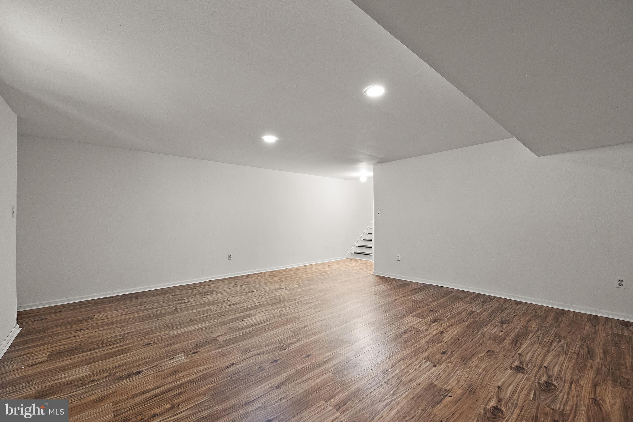 78 3 Rivers Drive Newark, DE 19702 - Photo 20 of 27 a view of an empty room with wooden floor