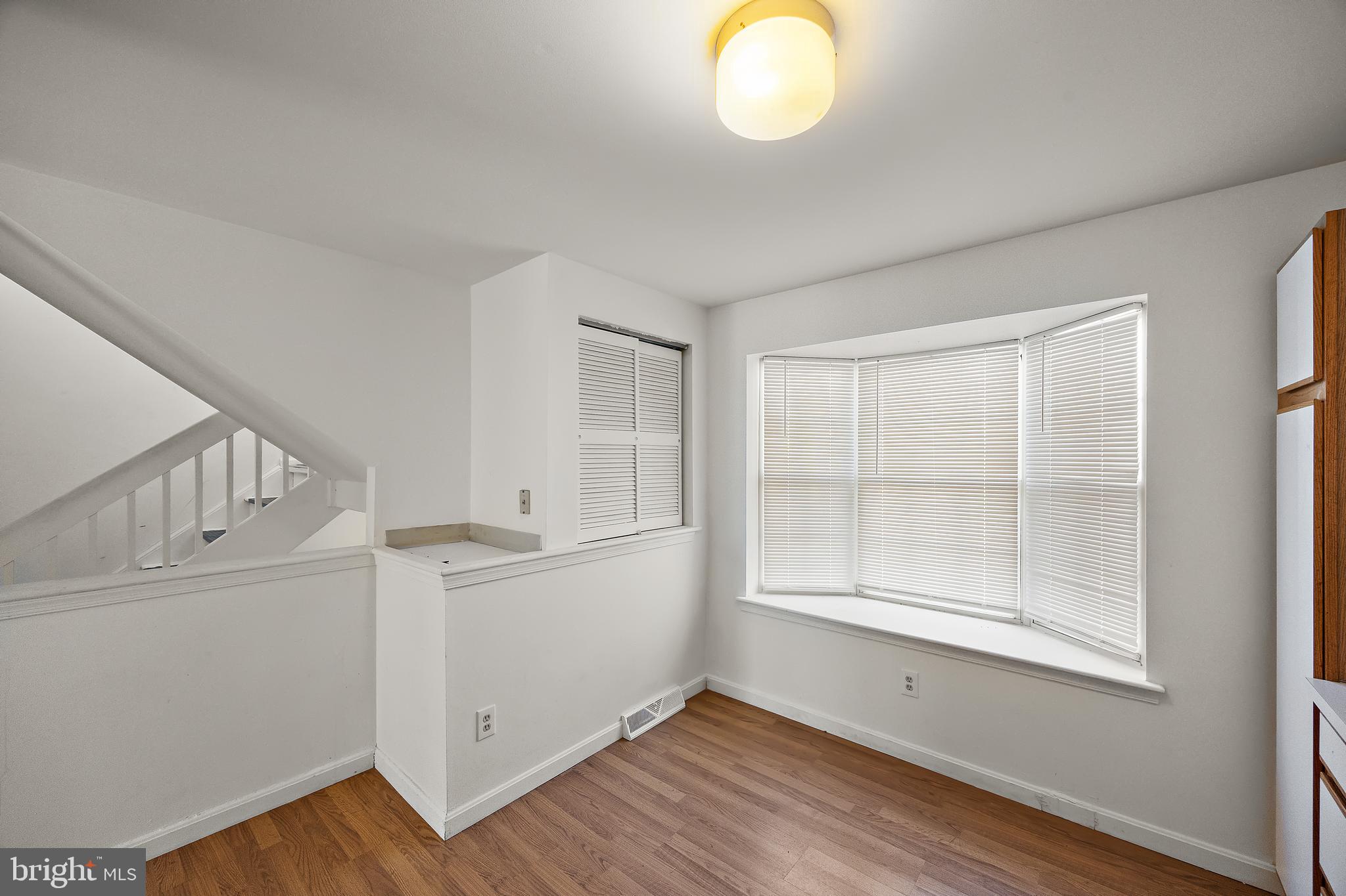 78 3 Rivers Drive Newark, DE 19702 - Photo 4 of 27 a view of empty room with wooden floor and fan