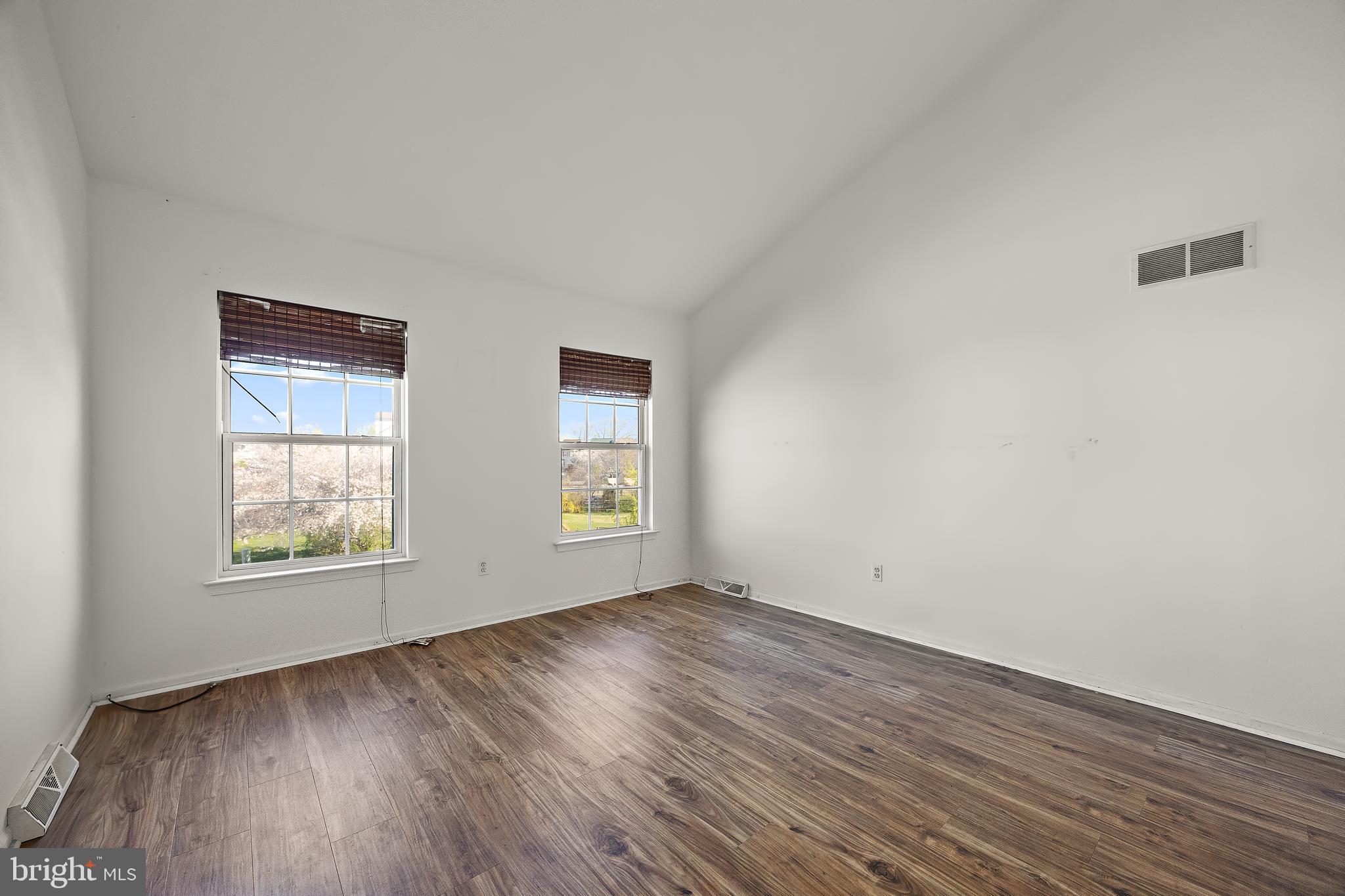 78 3 Rivers Drive Newark, DE 19702 - Photo 9 of 27 an empty room with wooden floor and windows