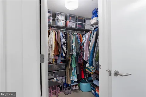 a bathroom with a double vanity sink toilet and shower