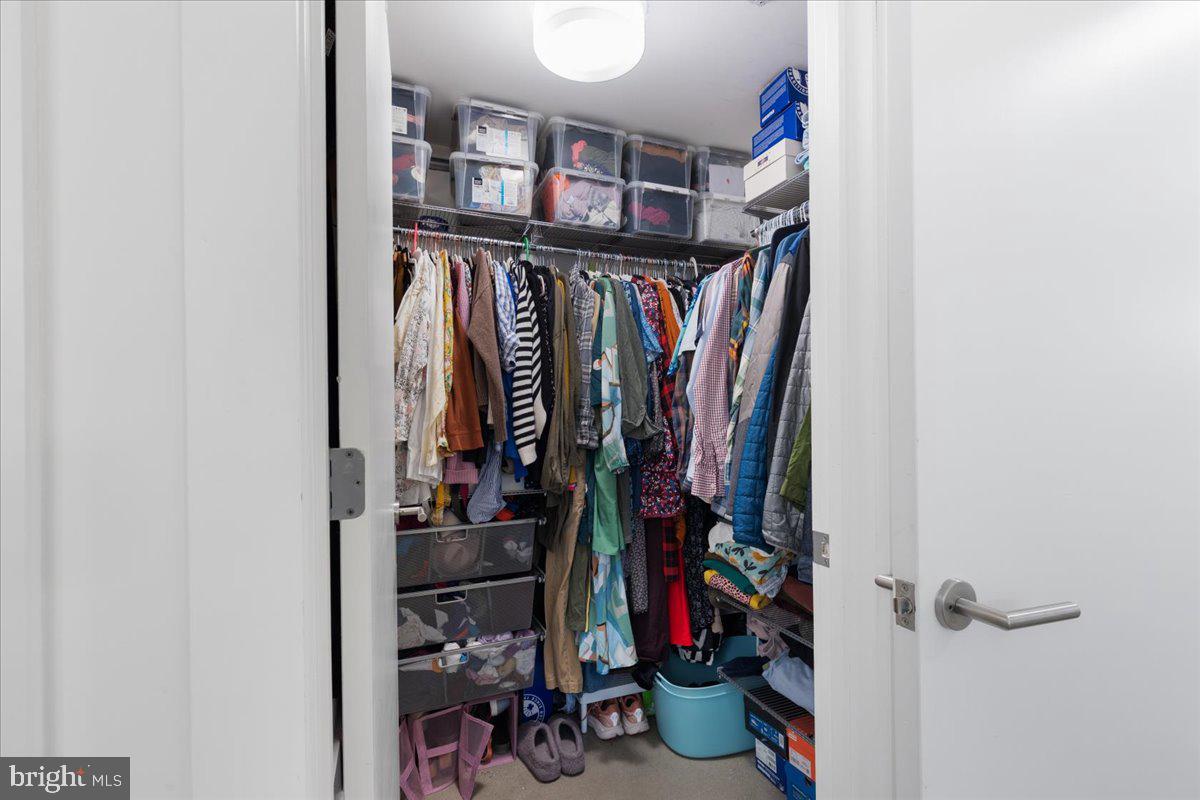 2818 Connecticut Avenue Northwest, Unit 104 Washington, DC 20008 - Photo 14 of 27 a view of walk in closet with clothes and shoes