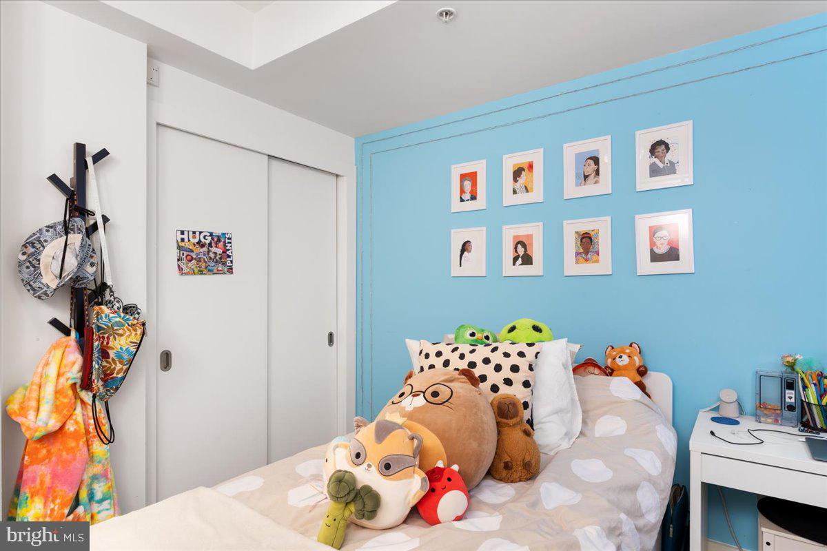 2818 Connecticut Avenue Northwest, Unit 104 Washington, DC 20008 - Photo 18 of 27 a bedroom with a bed and a table in it