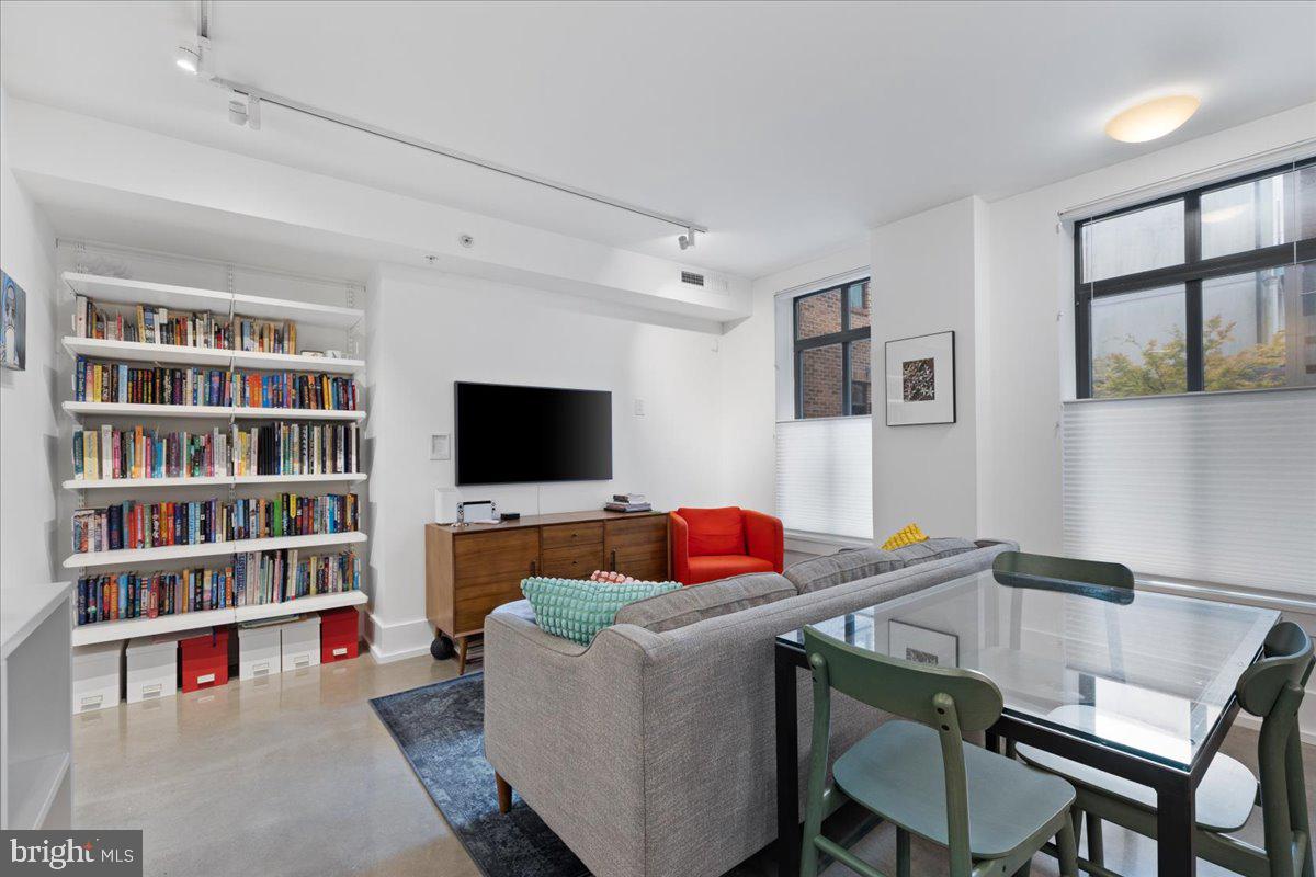 2818 Connecticut Avenue Northwest, Unit 104 Washington, DC 20008 - Photo 5 of 27 a living room with furniture and a flat screen tv