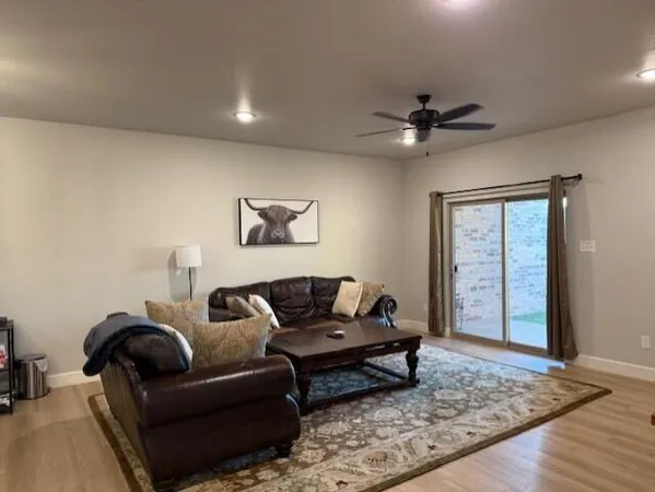 a living room with furniture and a rug