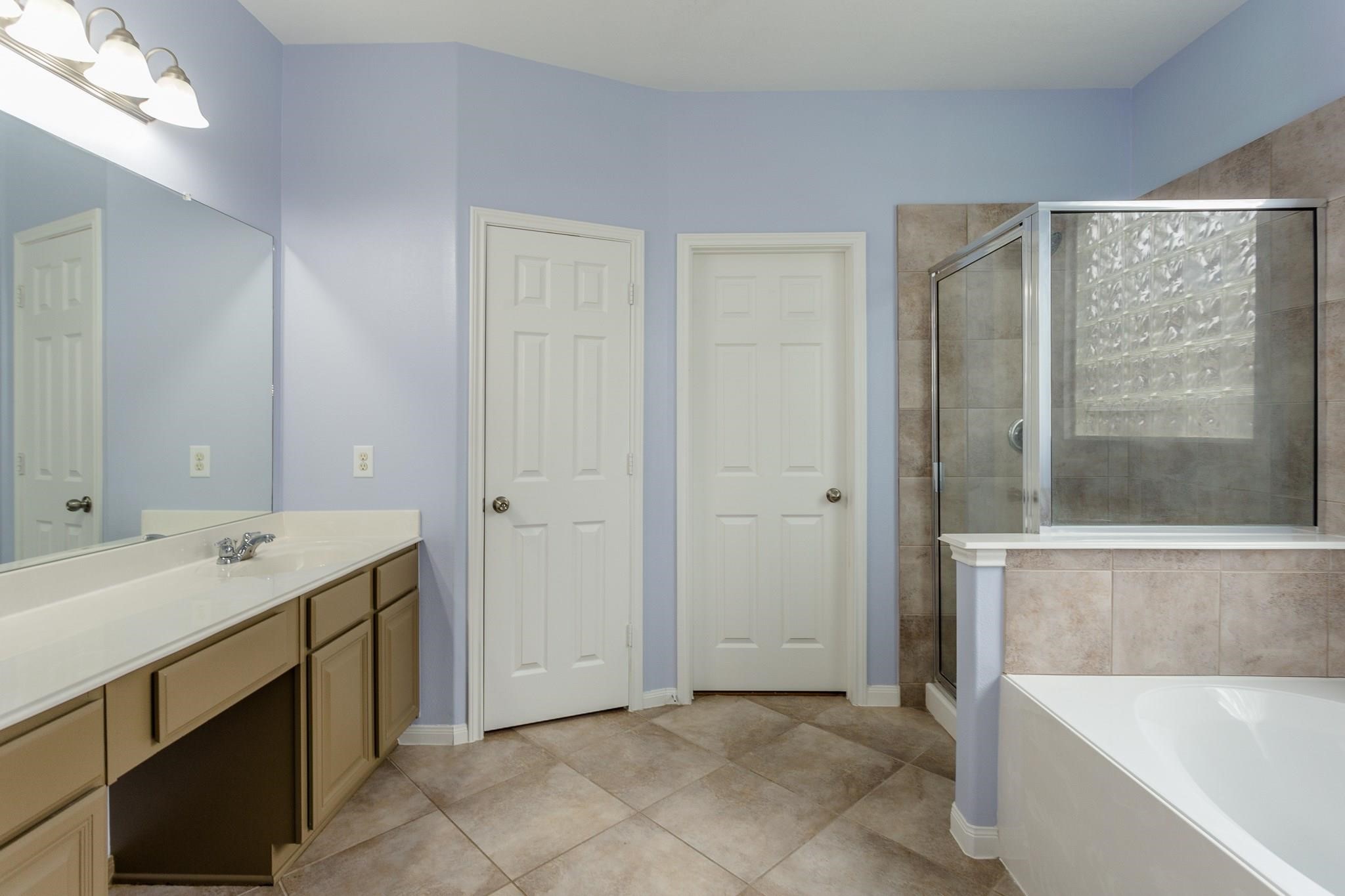 3430 Lilac Ranch Drive Katy, TX 77494 - Photo 16 of 29 a bathroom with a tub sink and mirror