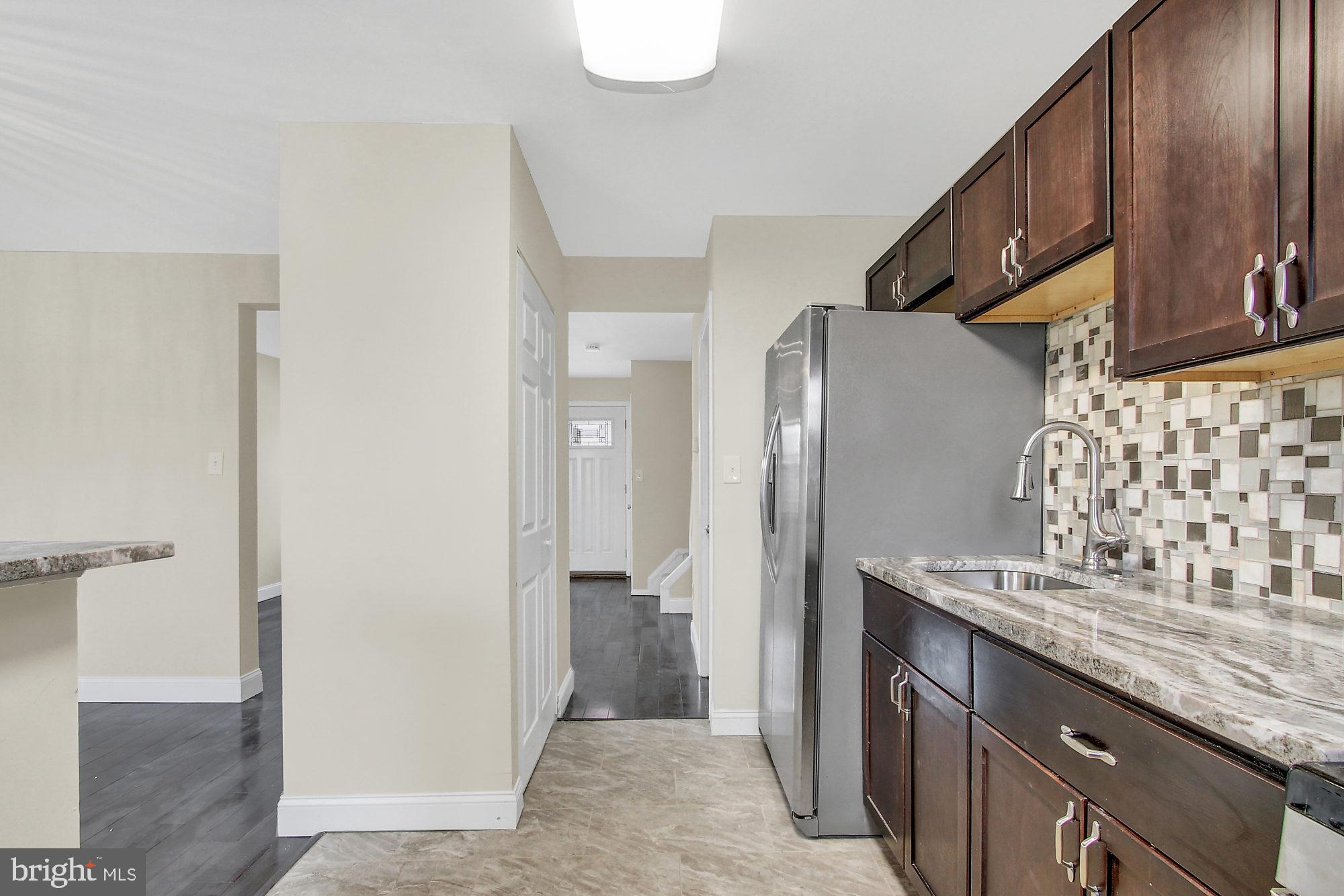 4213 Labyrinth Road Baltimore, MD 21215 - Photo 2 of 19 Rich Granite with Elegant Backsplash