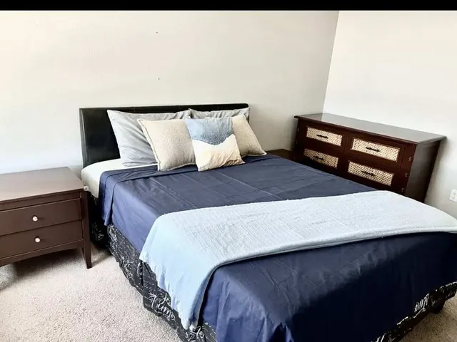 a bathroom with a toilet and a window