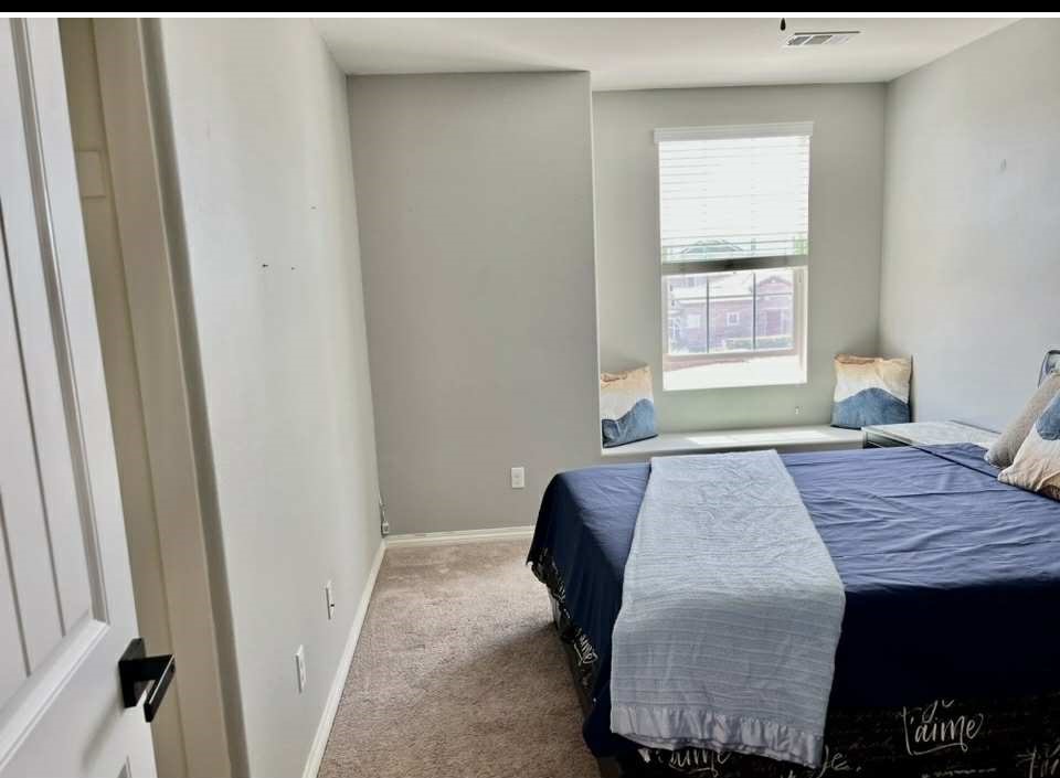 31509 Tuberose Road Murrieta, CA 92563 - Photo 23 of 41 a bedroom with a bed and a window